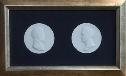 A framed pair of Berlin porcelain medallions