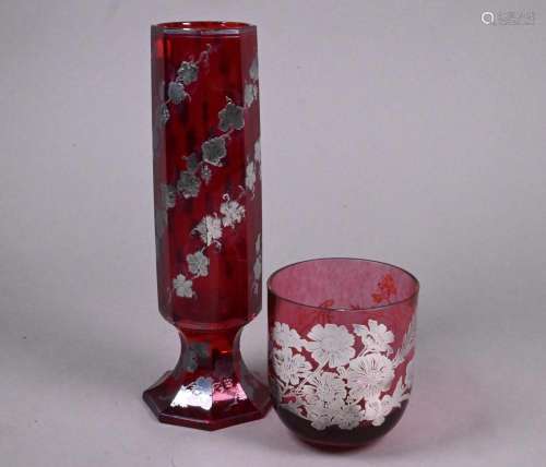A silver inlaid cranberry beaker and Bohemian ruby spill vas...