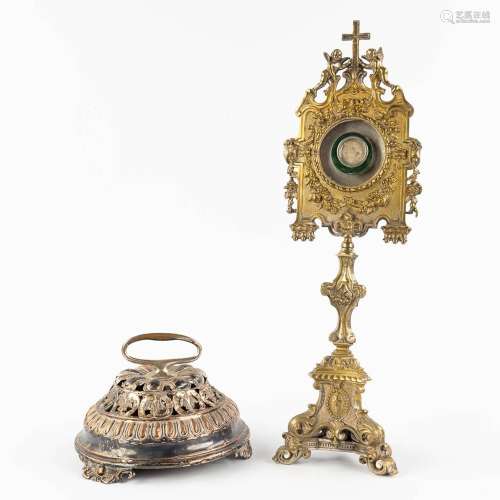 An altar bell and monstrance, silver plated metal and brass....