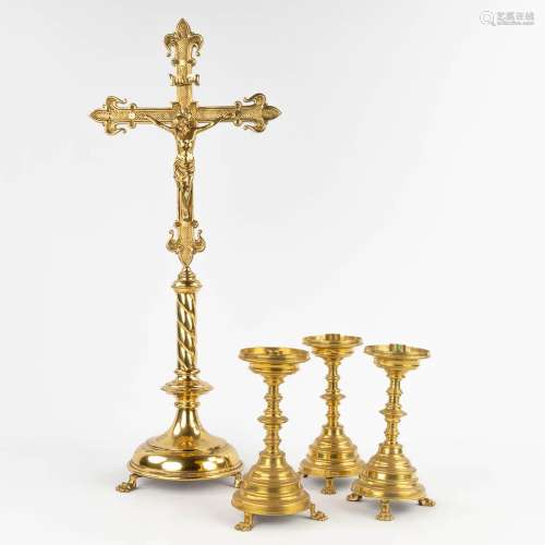 An antique bronze crucifix and 3 matching candelabra, standi...