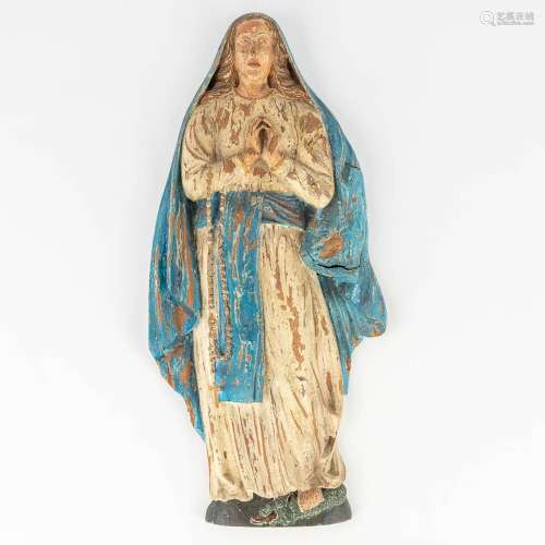 An antique wood sculpture of Madonna standing on the serpent...