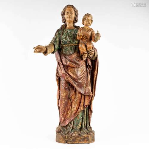 An antique wood-sculptured Madonna with Child. 19th C. (L: 2...
