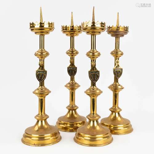 A set of 4 Church candlesticks made of bronze in gothic revi...