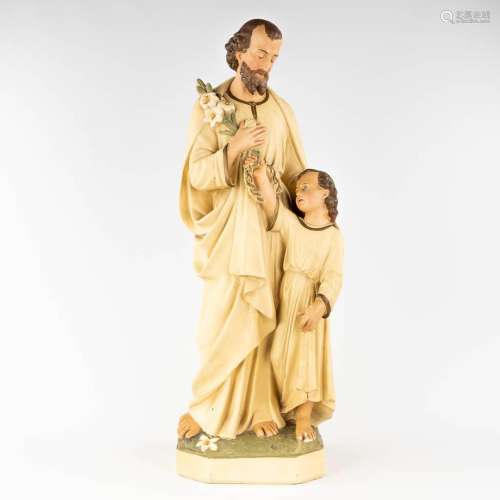 A large figurine of Joseph with Child, made of patinated pla...