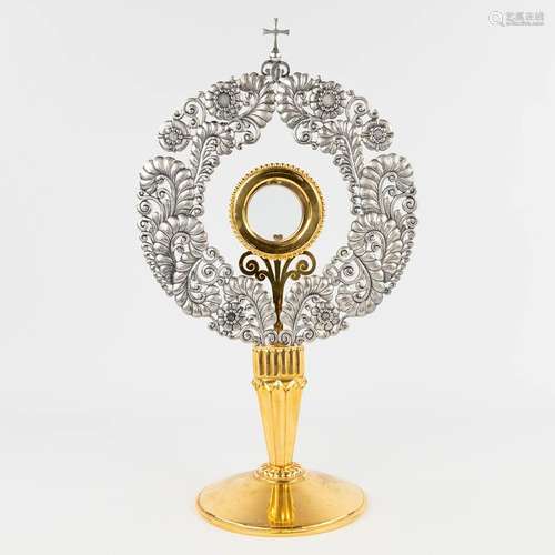 A modernist monstrance, silver-plated decorated with flowers...