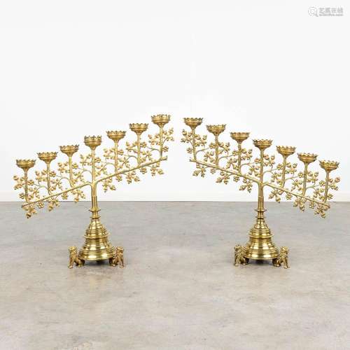 A pair of bronze 7-armed church candlesticks mounted on lion...