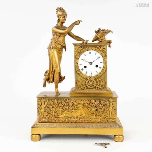 An antique mantle clock, made of bronze during empire period...