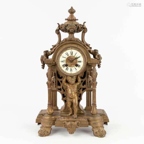 A bronze mantle clock, decorated with putti. Circa 1900. (L:...