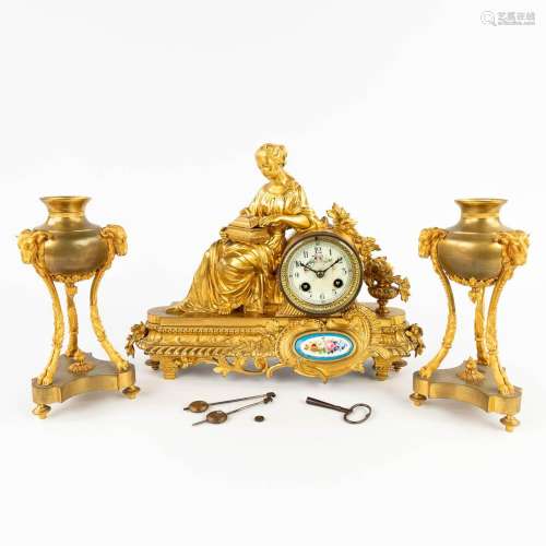 A mantle clock and a pair of cassolettes, gilt bronze. 19th ...