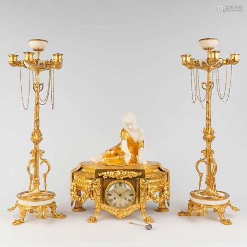 Henry PICARD (XIX) A three-piece garniture clock and candela...