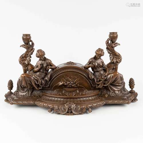 An antique mantle piece, decorated with female figurines and...