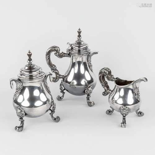 A solid silver Coffee and tea pot, with a milk jug. Probably...