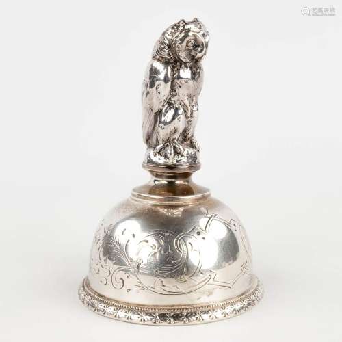 A table bell made of silver, decorated with an owl. 101g. (H...