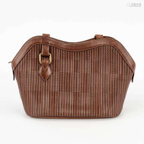 Delvaux 'Toile De Cuir' handbag made of brown leather. (W: 3...