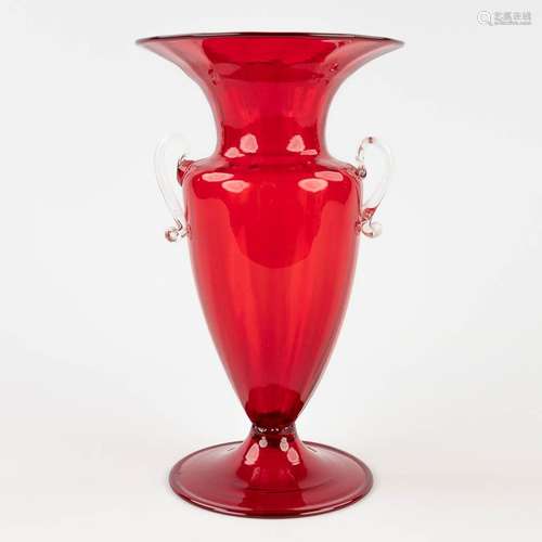 A vase made of red and clear glass, Murano Italy. Circa 1920...