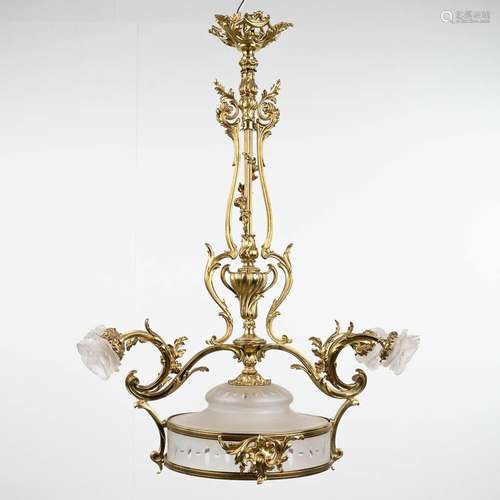 A chandelier, bronze in Louis XV style and finished with gla...