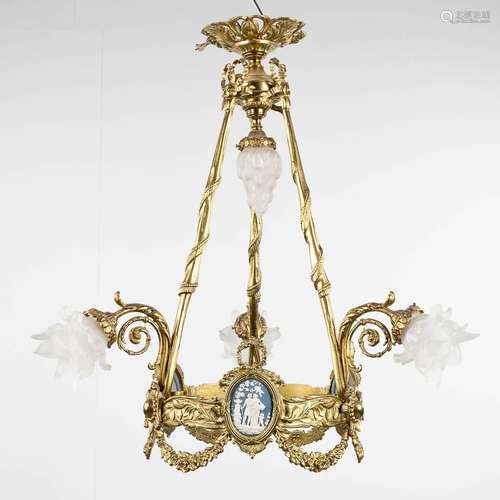 A chandelier, bronze in Louis XVI style decorated with Wedge...