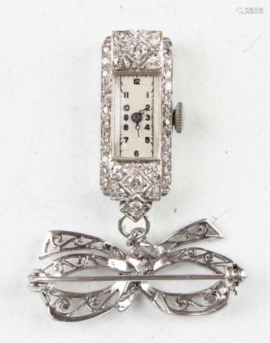 A diamond set platinum shaped rectangular cased pendant watc...