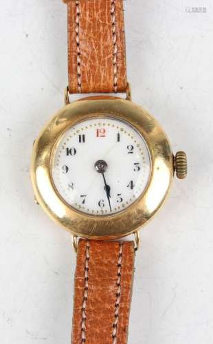 An 18ct gold circular cased lady's wristwatch with unsigned ...