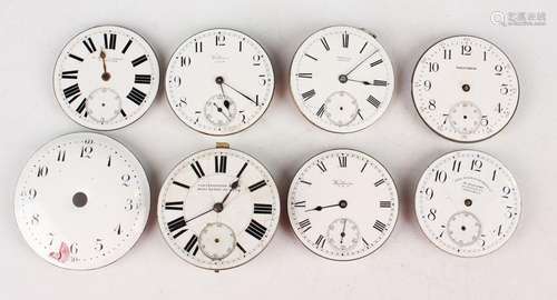 A large collection of pocket watch movements and dials