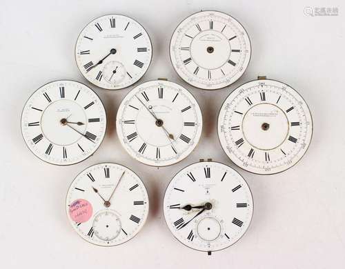 A large collection of pocket watch movements and dials