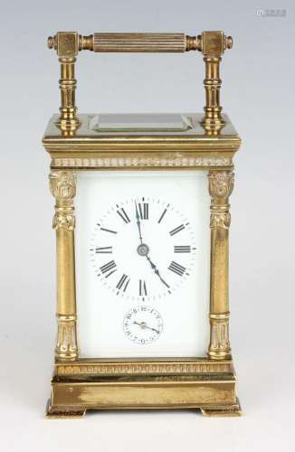 An early 20th century brass cased carriage alarm clock with ...