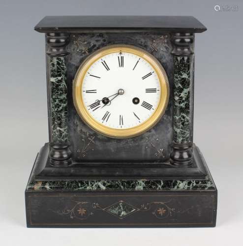 A late 19th century slate mantel clock with eight day moveme...