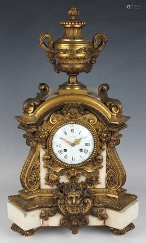 A late 19th century ormolu mounted white marble mantel clock...