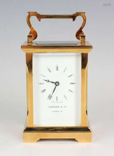 A late 20th century lacquered brass cased carriage timepiece...