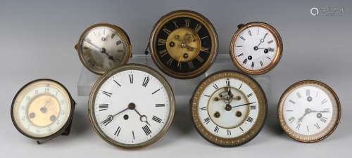 A collection of mantel clock movements and dials