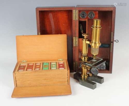 A late 19th century lacquered brass monocular field microsco...