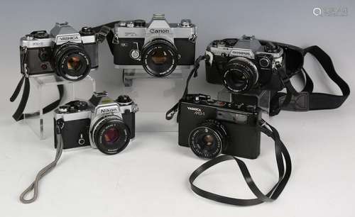 A collection of 35mm cameras and lenses