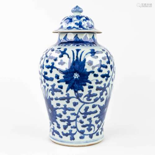 An antique Chinese vase with lid with blue-white floral deco...