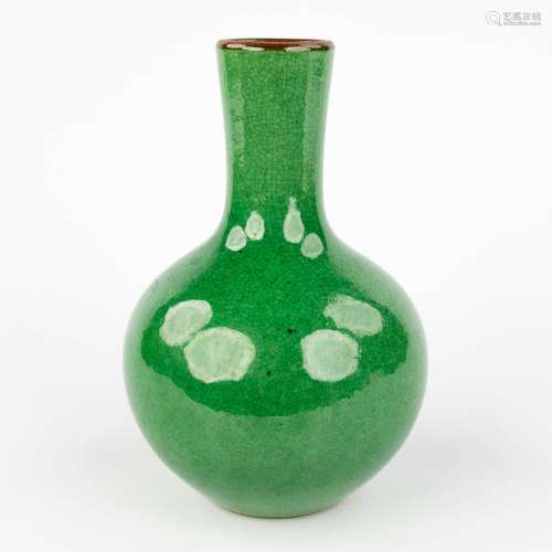 A celadon Chinese vase with green glaze. (H: 24 x D: 15 cm)