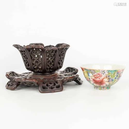 A Chinese porcelain bowl with a floral decor in a sculptured...