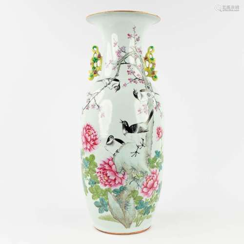 A Famille Rose Chinese vase decorated with birds and branche...