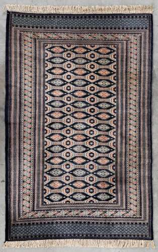 An Oriental hand-made carpet Buchara/Bokhara. (199 x 126 cm)...