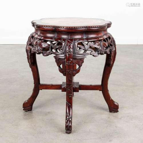 A Chinese hardwood stand with marble top. (H: 48 x D: 45 cm)
