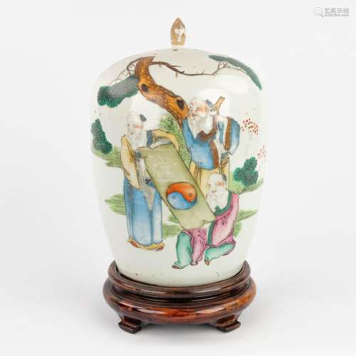 A Chinese porcelain jar with a lid, decorated with wise men ...