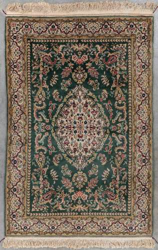 An Oriental hand-made carpet, Tabriz. (L: 205 x W: 135 cm)
