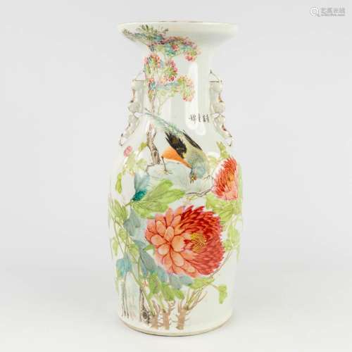 A Chinese vase decorated with lotus flowers and a bird. 19th...