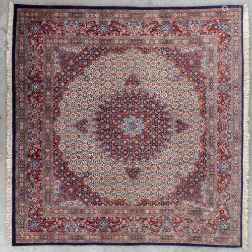 An Oriental hand-made carpet. (L: 206 x W: 195 cm)