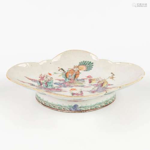 A Chinese bowl, vide poche, decorated with wise men, childre...