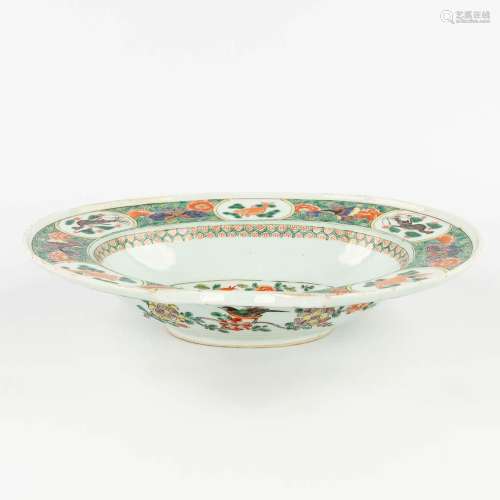 A Chinese shaving bowl, Famille Verte, and decorated with fa...