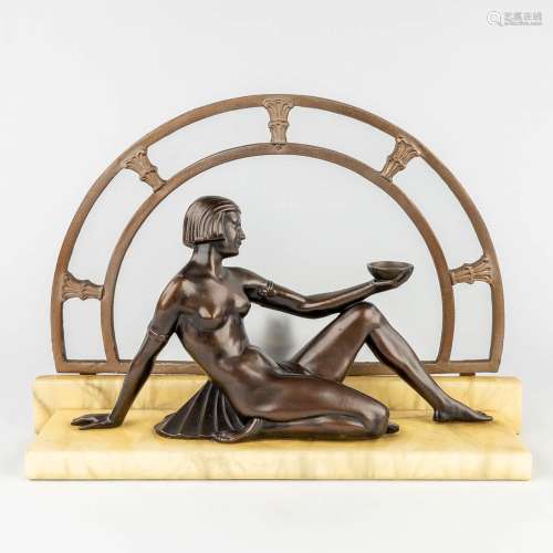 A figurative table lamp with nude female in art deco style. ...