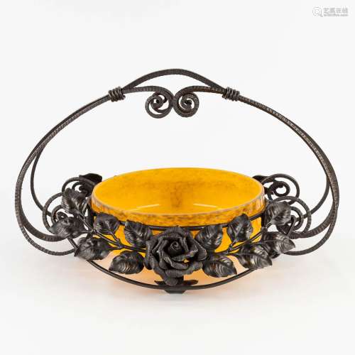 A fruit bowl with handle, made of wrought iron and pate de v...