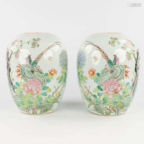 A pair of Chinese vases 'Famille Rose', decorated with fauna...