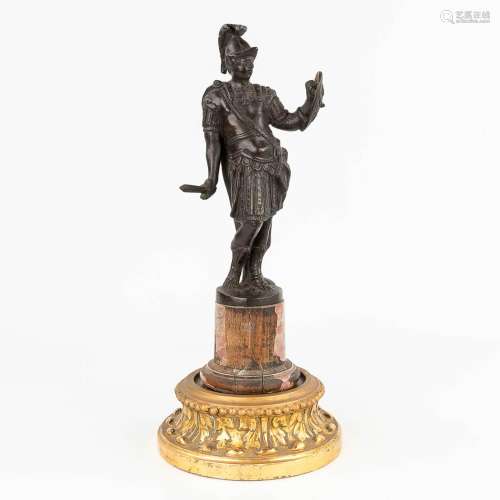 An bronze figurine of a warrior with sword and shield. (H: 3...