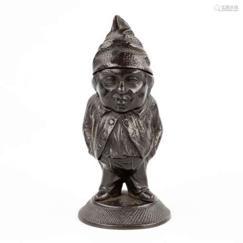 A match holder in the shape of a gnome. Illegibly signed on ...