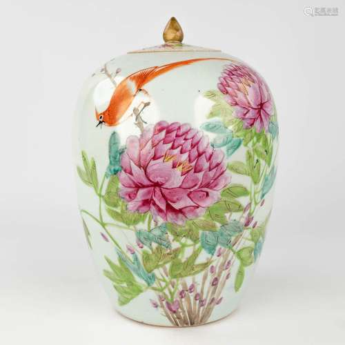 A Chinese vase decorated with peonies, a bird and calligraph...